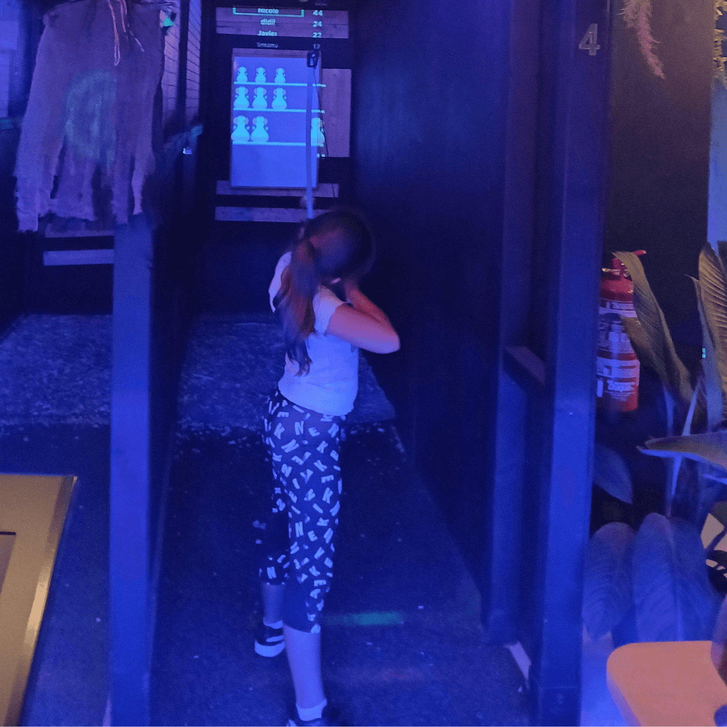 A family enjoying an interactive axe throwing session in Playa Las Américas, Tenerife. Perfect for kids (8+) and adults for an unforgettable adventure!